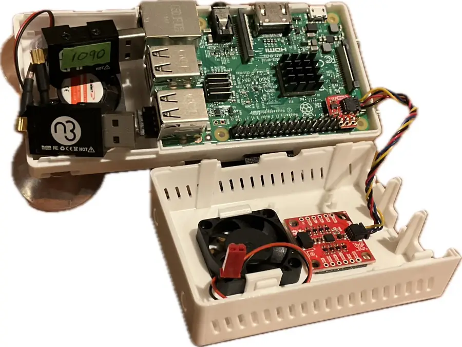 Stratux parts layout including Pi, SDRs, GPS, and fans